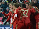 Toni Kroos is congratulated by team mates moments after scoring on December 1, 2012