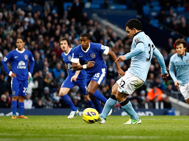 Carlos Tevez steps up to score the penalty to equalise for his team against Everton on December 1, 2012
