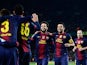 Cesc Fabregas is congratulated by his team mates after scoring his team's fourth goal on December 1, 2012