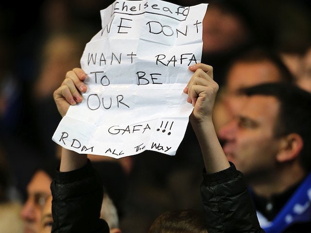 A young Chelsea fan holds up an anti-Rafa Benitez sign on November 28, 2012