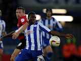 Cardiff's Craig Bellamy and Sheffield Wednesday's Jeremy Helan battle for the ball on December 2, 2012