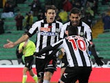 Udinese's Danilo Larangeira celebrates with team mates after scoring his team's third goal on December 2, 2012