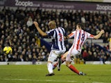 Dean Whitehead gets in front on Steven Reid to score against West Bromwich Albion on December 1, 2012