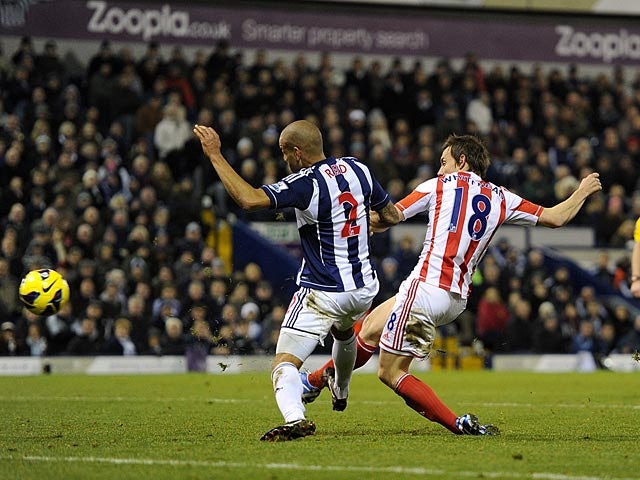 Dean Whitehead gets in front on Steven Reid to score against West Bromwich Albion on December 1, 2012