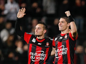 Nice's Eric Bautheac and Jeremy Pied celebrate their team's win over Paris Saint-Germain on December 1, 2012