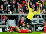 Bayern Munich's Franck Ribery and Borussia Dortmund's Lukasz Piszczek battle for the ball on December 1, 2012