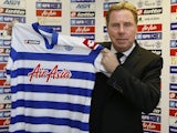 Harry Redknapp holds his QPR shirt proudly on November 26, 2012