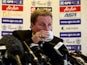 Thirsty Harry Redknapp has a drink from a cup on November 26, 2012