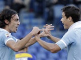 Lazio's Hernanes congraulates Giuseppe Biava after scoring the opener against Parma on December 2, 2012
