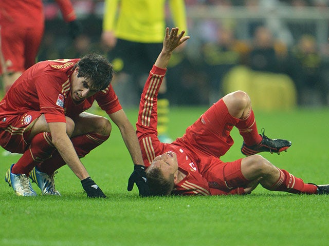 Holger Badstuber lies down injured on the pitch on December 1, 2012