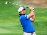 Jason Day watches his ball after taking his second shot on the first hole on November 29, 2012