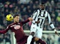 Juventus' Paul Pogba and Torino's Danilo D'Ambrosio battle for the ball on December 1, 2012