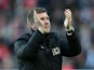 MK Dons manager Karl Robinson claps after the FA Cup match against AFC Wimbledon on December 2, 2012
