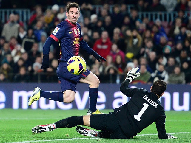 Barcelona's Lionel Messi scores the opener against Athletic Bilbao on December 1, 2012