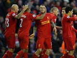 Danniel Agger is congratulated by team mates after scoring the opener on December 1, 2012