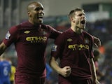 Maicon congratulates James Milner after scoring his team's second goal against Wigan on November 28, 2012