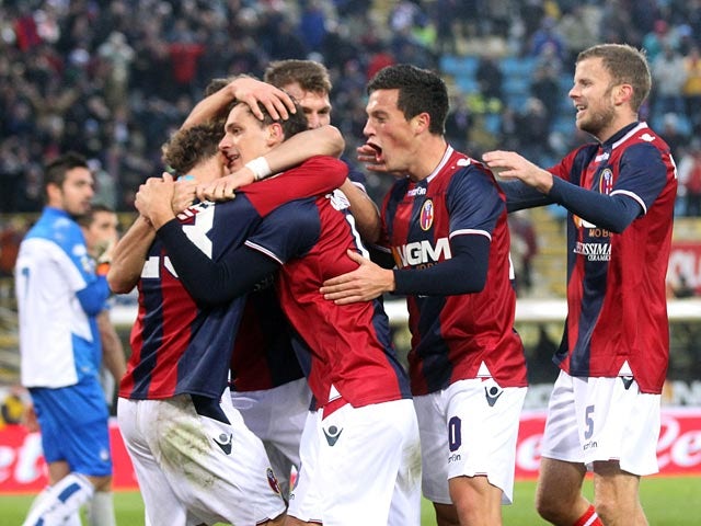 Bologna's Manolo Gabbiadini is congratulated by team mates after scoring the winner on December 2, 2012
