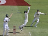 Australia's Michael Clarke and Matthew Wade celebrate after taking the wicket of South Africa's Robin Peterson on November 30, 2012.