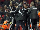 Michael Laudrup celebrates with his coaching staff after going 2-0 up against Arsenal on December 1, 2012