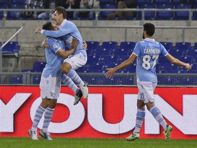 Miroslav Klose celebrates scoring for Lazio on November 27, 2012