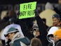 A Philadelphia Eagles fan holds up a "Fire Andy Reid" sign on November 26, 2012
