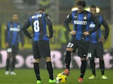 Inter forward's Diego Milito and Rodrigo Palacio kick-off following a Parma goal on November 26, 2012