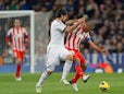 Real Madrid's Sami Khedira and Atletico Madrid's Cata Diaz battle for the ball on December 1, 2012