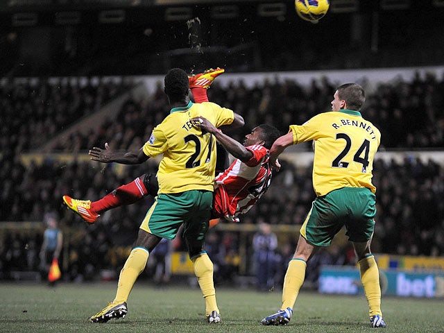 Stephane Sessegnon is closed down by Norwich as he attempts an overhead kick on December 2, 2012