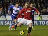 Wayne Rooney takes a penalty to score his team's second goal on December 1, 2012