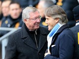 Manachester United manager Alex Ferguson and Manchester City Roberto Mancini shakes hands before kick off on December 9, 2012