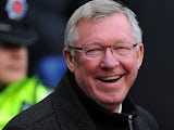 Manachester United manager Alex Ferguson smiles before kick off against rivals Manchester City on December 9, 2012