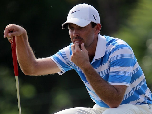 Charl Schwartzel lines up a putt at the Thailand Golf Championship on December 8, 2012