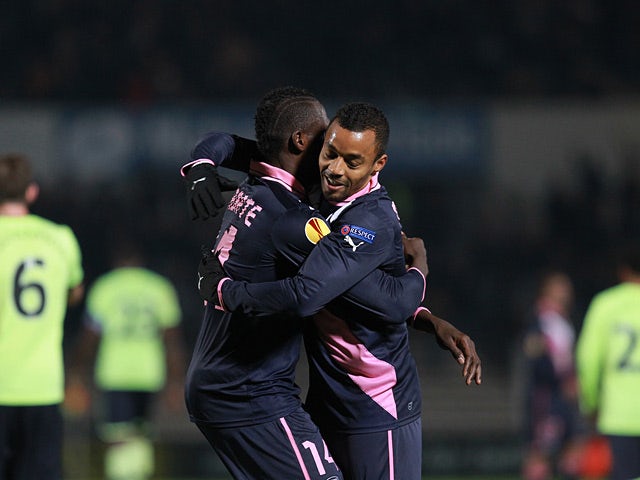 Bordeaux's Cheick Diabate is congratulated by team mate David Bellion after scoring the opener on December 6, 2012