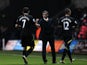 Norwich boss Chris Hughton with his players after victory over Swansea on December 8, 2012