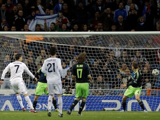 Real Madrid's Cristiano Ronaldo opens the scoring against Ajax on December 4, 2012