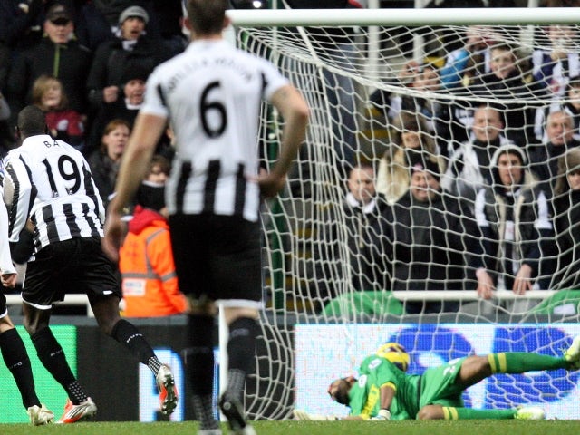 Newcastle United's Demba Ba scores from a penalty on December 3, 2012