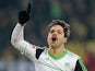 Wolfsburg's Diego celebrates after converting a penalty on December 8, 2012
