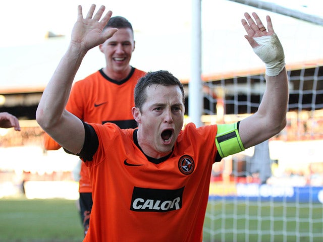 Dundee United's Jon Daly celebrates scoring a penalty against rivals Dundee on December 9, 2012