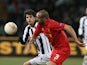 Liverpool's Jose Enrique and Udinese's Diego Fabbrini battle for the ball on December 6, 2012