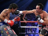 Juan Manuel Marquez lands a punch straight in the face of Manny Pacquiao on December 9, 2012