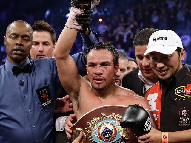 Juan Manuel Marquez is announced as the winner after knocking out Manny Pacquiao on December 9, 2012