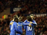 Chelsea players congratulate Juan Mata after a goal on December 8, 2012