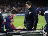 Barca star Lionel Messi is stretchered off injured on December 5, 2012