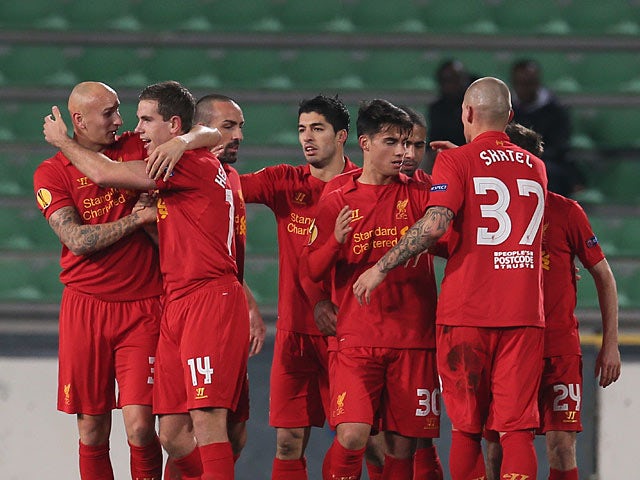 Liverpool team mates congratulate Jordan Henderson after scoring the opener on December 6, 2012