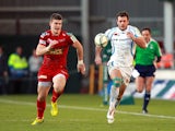 Exeter Chiefs' Luke Arscott and Scarlets' Scott Williams chase down a through ball on December 8, 2012