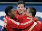 Bayern's Mario Gomez is congratulated by his team mates after scoring on December 8, 2012