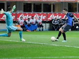 Inter Milan's Marko Livaja slots the ball past Neftci goalkeeper Sasa Stamenkovic on December 6, 2012