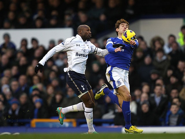 Nikica Jelavic and William Gallas battle for the ball on December 9, 2012