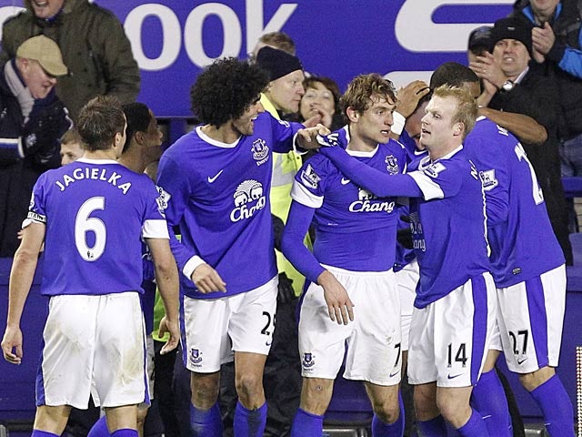 Nikica Jelavic is congratulated by team mates after scoring the winner in stoppage time against Tottenham on December 9, 2012