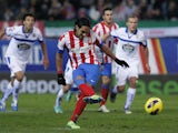 Radamel Falcao scores the third of his five goals against Deportivo in a 6-0 win on December 9, 2012